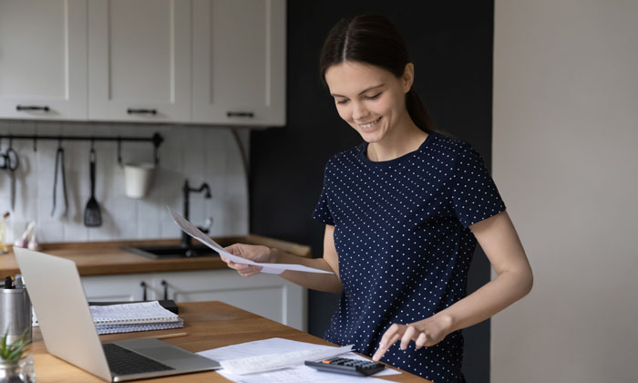 young woman checking invoicing for a home business