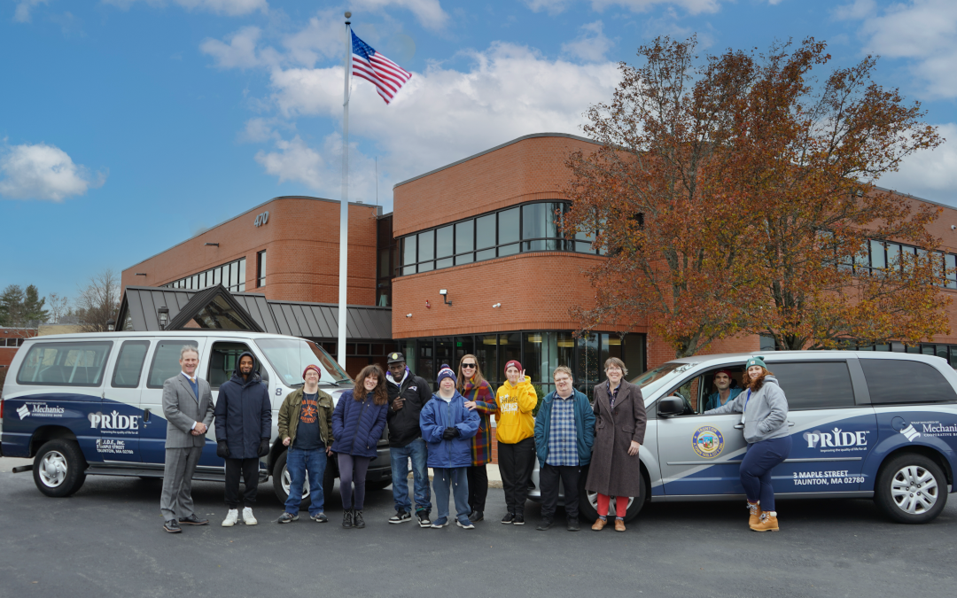 Mechanics Cooperative Bank President & CEO Joseph T. Baptista Jr. and Senior Vice President, Chief Compliance & Risk Management Officer, Joanna Holmes, a proud Pride Inc. Board Member, are pictured with the newly wrapped transportation vans. They are joined by Pride Inc. Executive Director Sarah Campbell and members of Pride Inc. The wrap installation was completed locally by Luka B Signs of Taunton.